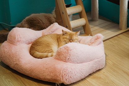 Pink plush cat bed